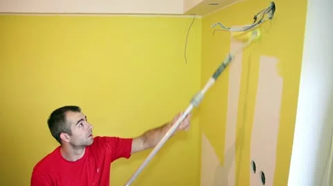 Painting the Wall in Yellow Stock Footage