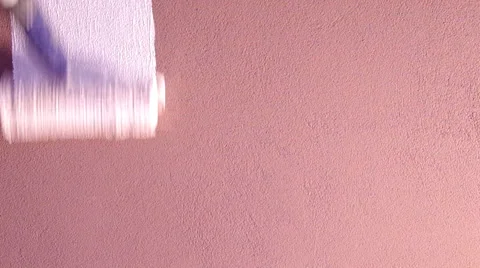 Painting walls with a roller Stock Footage 32890658