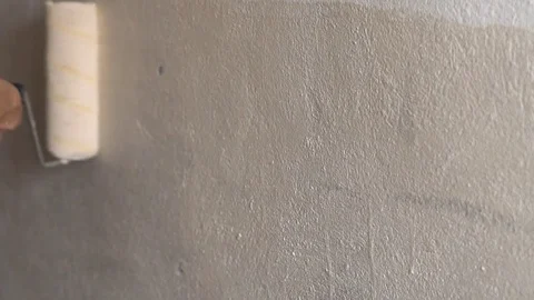 Painting walls with a roller Stock Footage 82813261