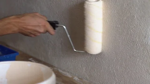 Painting walls with a roller Stock Footage 82891670