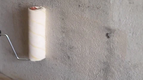 Painting walls with a roller Stock Footage 83197070