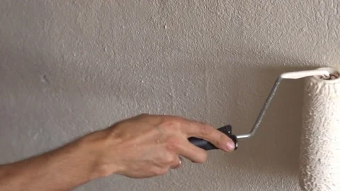 Painting walls with a roller Stock Footage 83197116
