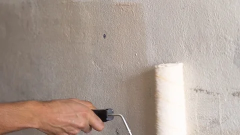 Painting walls with a roller Stock Footage 83197264