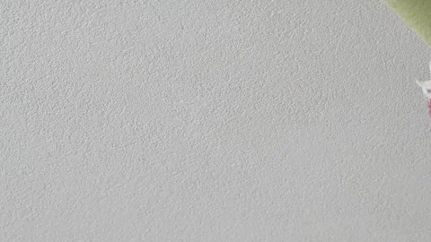 Painting White Wall with Roller Close Up – Home Renovation Stock Footage 331538257