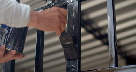 Painting without gloves makes a mess.Close up man's hands painting a steel. Stock Footage 289557685