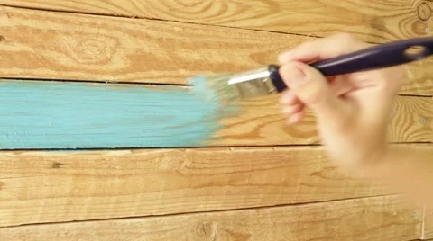 Painting wooden wall to blue colour Stock Footage