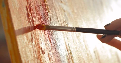 Paintress is drawing abstract picture using brush on canvas, hand closeup. Stock Footage 123233388