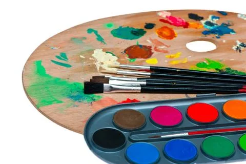 Paints and brushes. Stock Photos