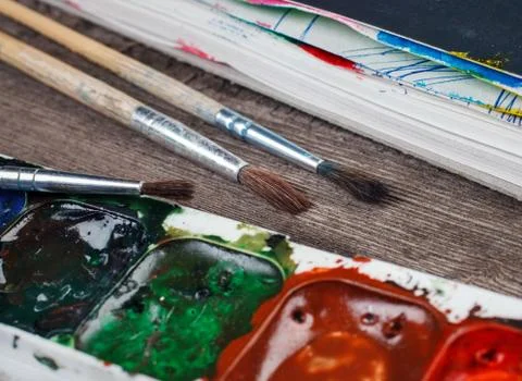 Paints and brushes Stock Photos