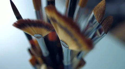Paints and brushes on the table Stock Footage 47750605