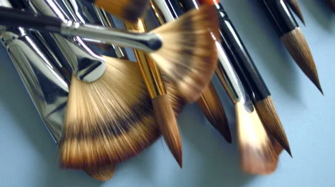 Paints and brushes on the table Stock Footage 47751050