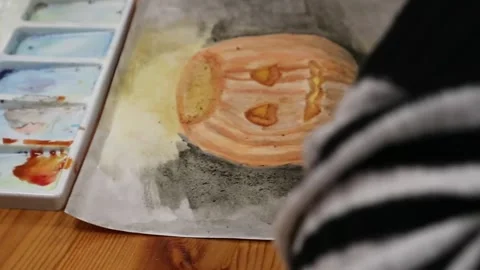 Paints, brushes and albums on the table. Shooting drawing top view Stock Footage 144883586