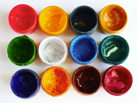 Paints multicolored on a light background close-up horizontally from above Stock Photos