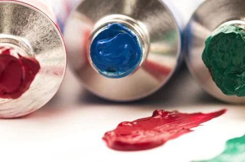 Paints on the white paper Stock Photos