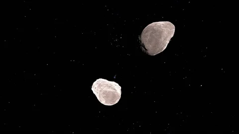Pair of asteroids in orbit around planet Stock Footage 133210839