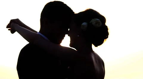 Pair of backlit newlyweds face to face. Stock Footage 60564537