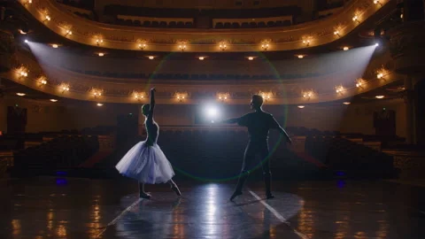 Pair of ballet dancers practice on theatre stage Stock Footage 238072172