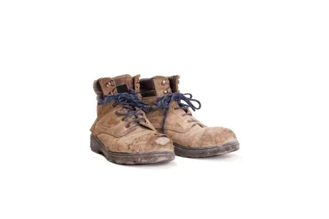 Pair of battered old worker boots Stock Photos