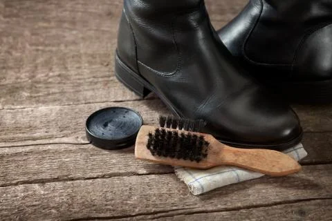 Pair of black boot,brush and polish cream Stock Photos
