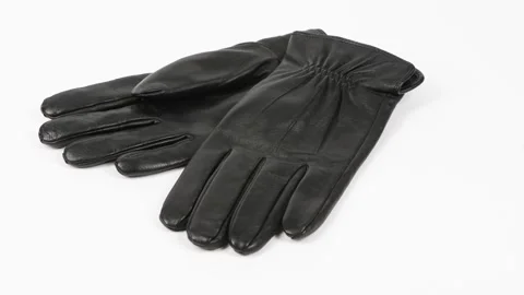 Pair black of leather gloves isolated on white. Side view Stock Footage 168481422