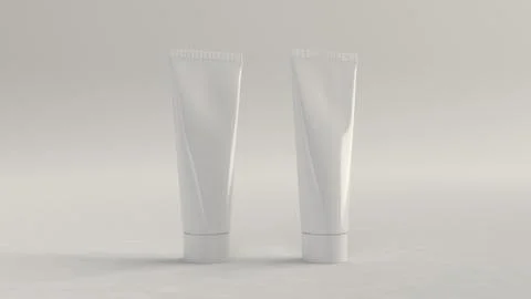 Pair of blank white tubes of toothpaste, cream or gel Illustrazione stock