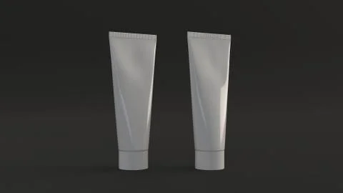 Pair of blank white tubes of toothpaste, cream or gel Illustrazione stock