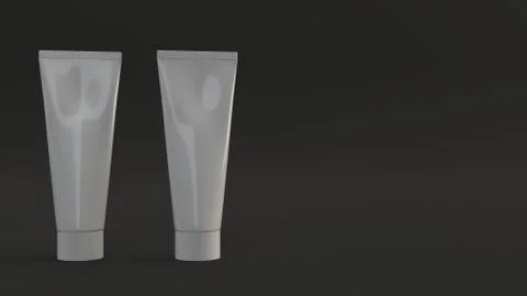 Pair of blank white tubes of toothpaste, cream or gel Illustrazione stock