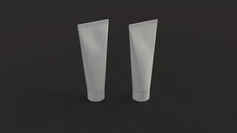 Pair of blank white tubes of toothpaste, cream or gel Illustrazione stock