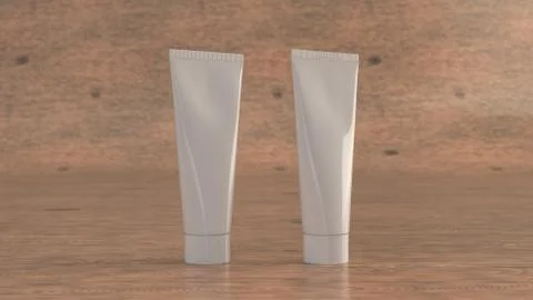 Pair of blank white tubes of toothpaste, cream or gel Illustrazione stock