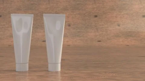 Pair of blank white tubes of toothpaste, cream or gel Illustrazione stock