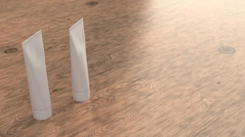 Pair of blank white tubes of toothpaste, cream or gel Illustrazione stock