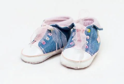 Pair of blue and white baby shoes. Stock Photos