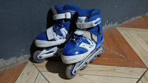 Pair of Blue Roller Skates Stock Photos