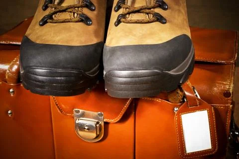 Pair of boots with suitcase Stock Photos