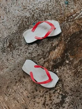 A pair of broken rubber flip flops Stock Photos