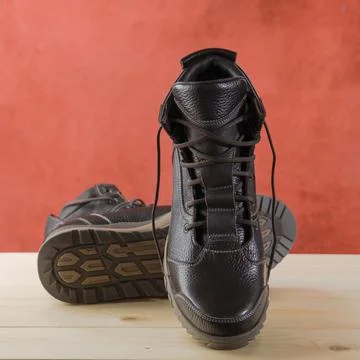 Pair of brown hiking boots Stock Photos