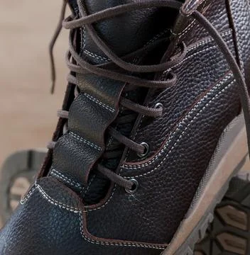 Pair of brown hiking boots Stock Photos