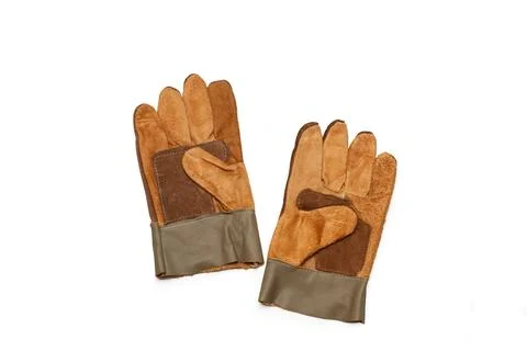 A pair of brown leather work gloves on a white background with copy space Stock Photos