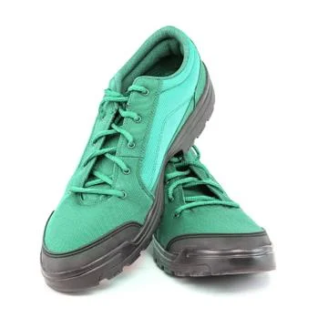 A pair of cheap aqua mint turquoise green hiking shoes isolated on white Stock Photos