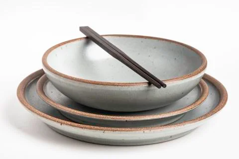 A Pair Of Chopsticks On Stoneware Dinner Set Stock Photos