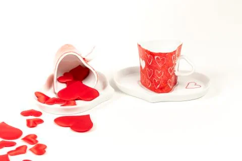 Pair of coffee cups surrounded by red hearts. Concept of valentine. Foto stock
