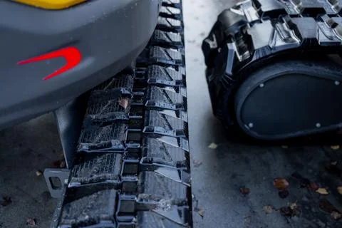 Pair of compact excavator crawler tracks Stock Photos