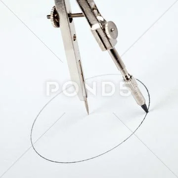 Pair of compasses drawing circle Stock-Fotos