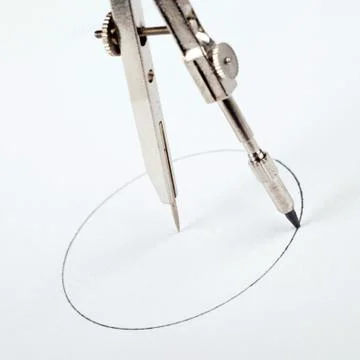 Pair of compasses drawing circle Stock Photos