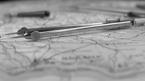 Pair of Compasses Measuring Distance on Retro Map Close Up Black and White Stock Footage 141889310