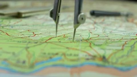 Pair of Compasses used for Measuring Distance on Retro Map Fast Motion Close Up Stock Footage 141889262