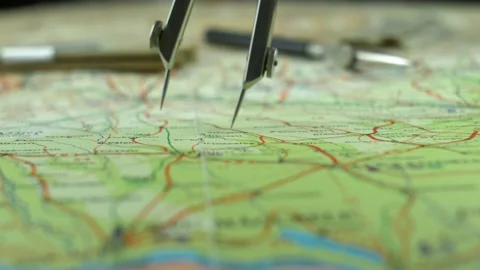 Pair of Compasses used for Measuring Distance on Retro Map Close Up Stock Footage 141889286