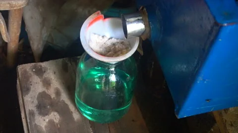 Pair is converted into a vodka, at the exit of the cooling system. The Stock Footage 94247119