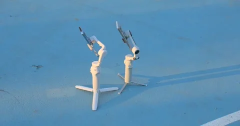 A Pair Of DJI Osmo Mobile Gimbals, A Smartphone Stabilizers. Close-up Shot Video stock 306772476