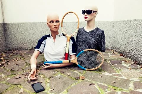 Pair of dummies take a selfie dressed in seventies tennis clothes Stock Photos